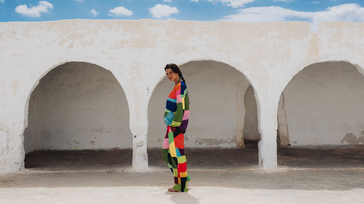 Woman wearing the Regio cotton set, a vibrant colorblocked design in pure Egyptian cotton.
